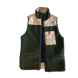 United by Blue vest.